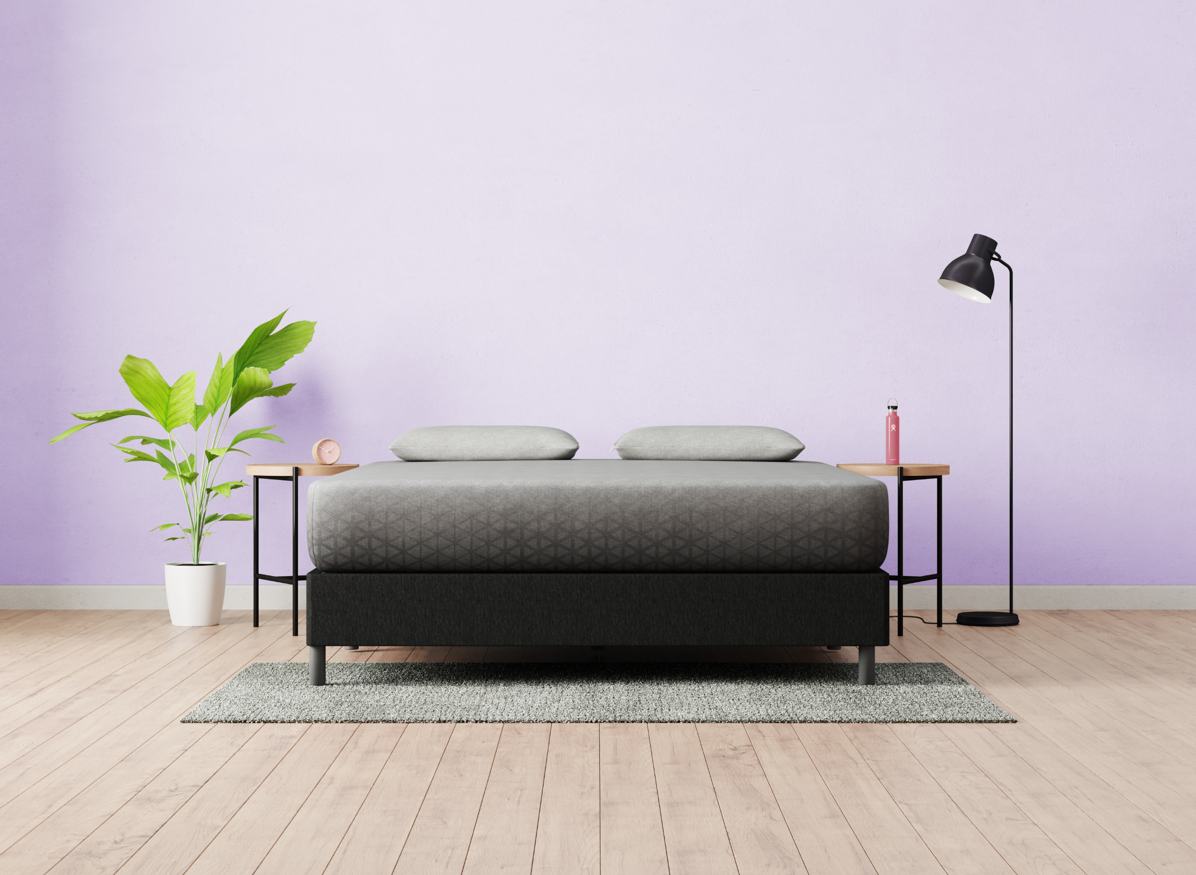 gray mattress on a black bed frame