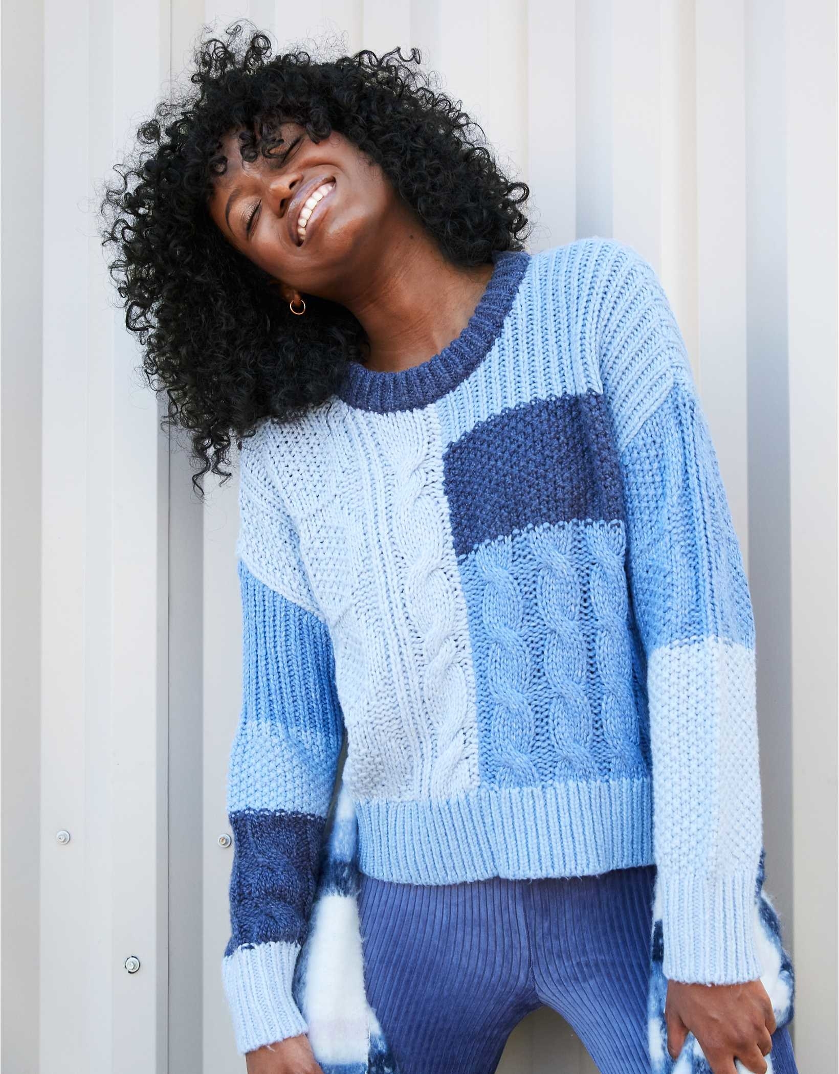 model wearing the blue patchwork knitted sweater