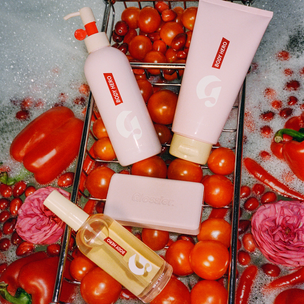 various body products on a bed of tomatoes