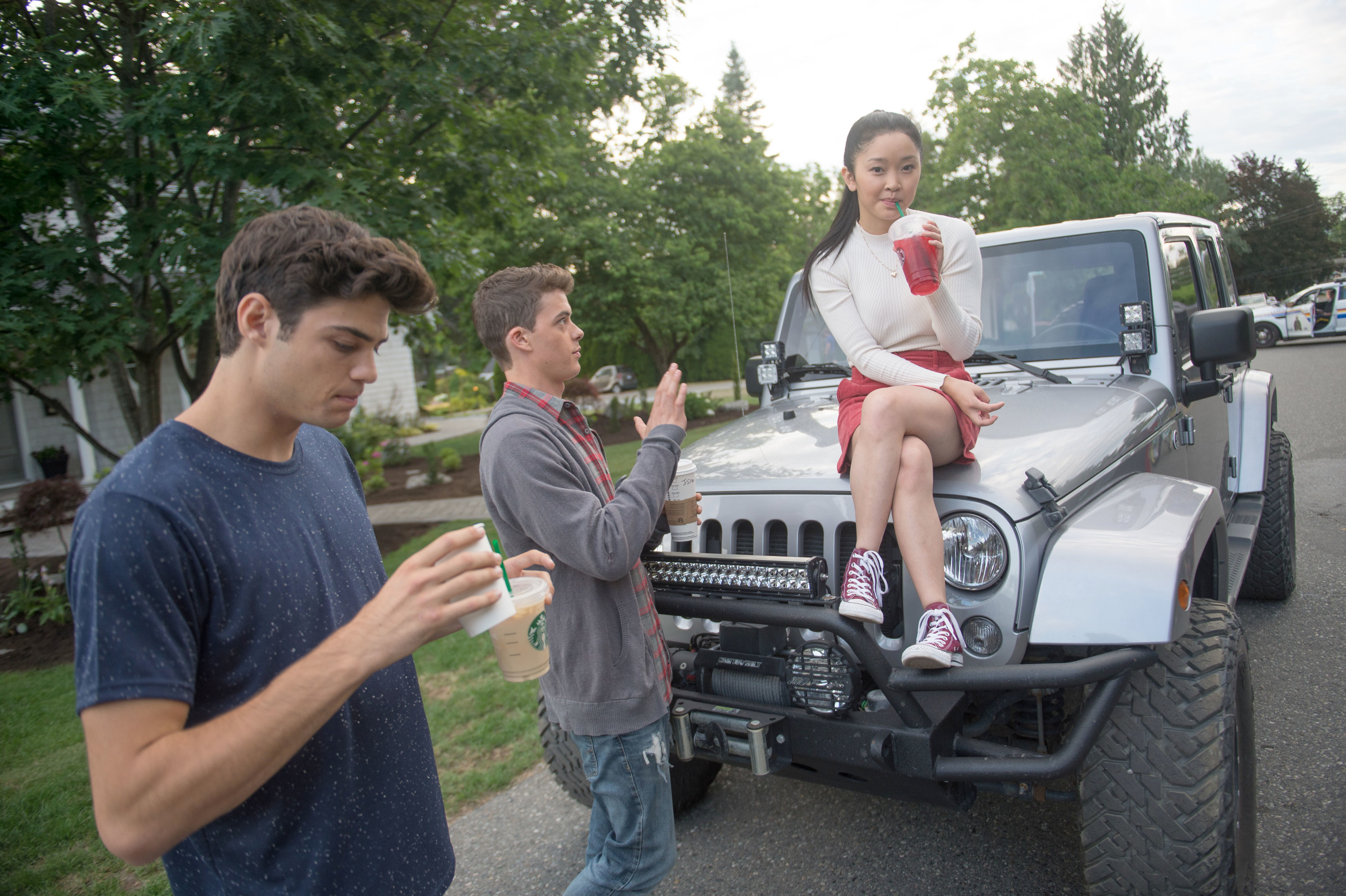 Peter, Josh, and Lara Jean drinking Starbucks