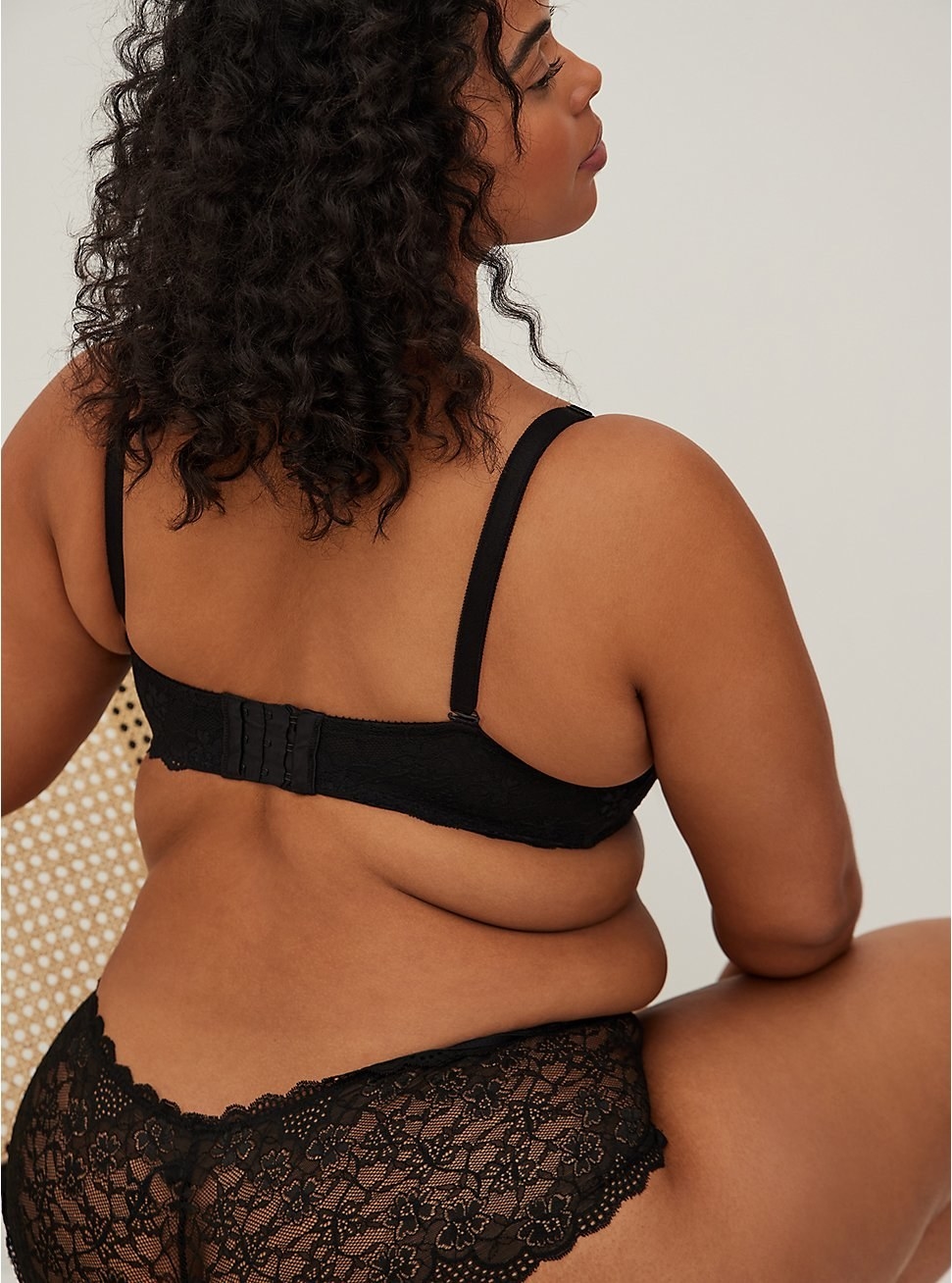 Back of model wearing black push-up bra