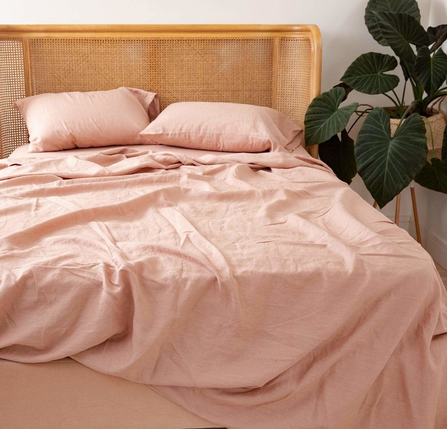 pink linen sheets on a bed