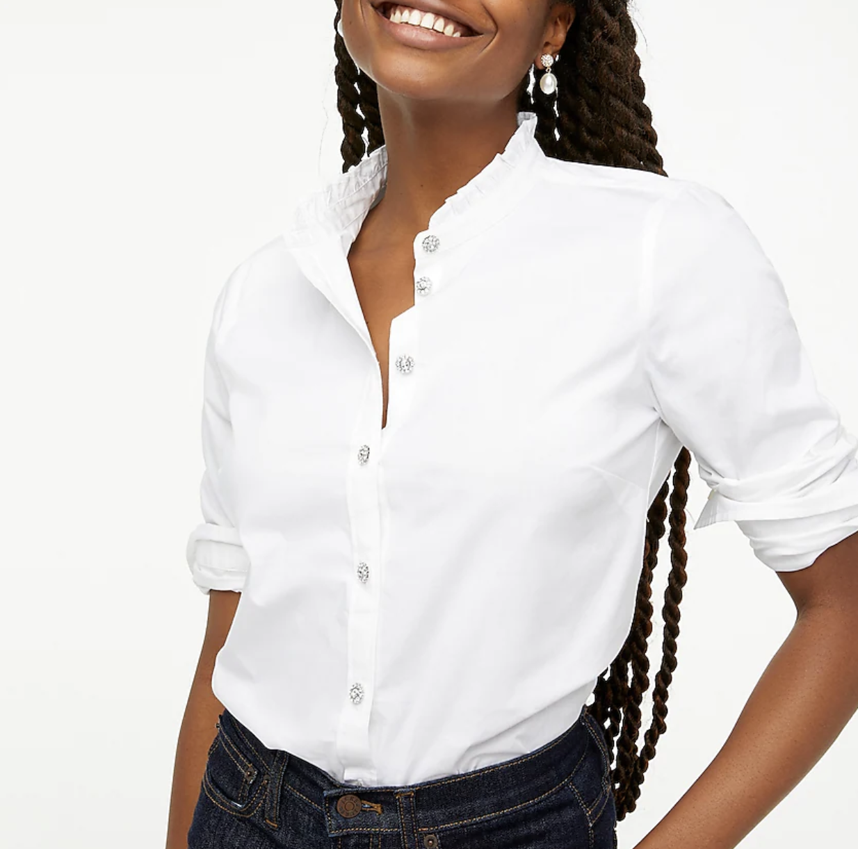 Model wearing white cotton poplin top with jewel buttons