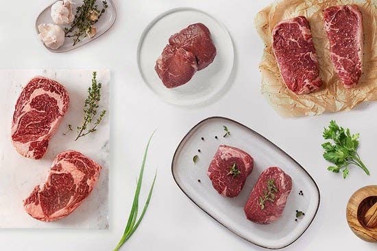 A flatlay photo of various steaks