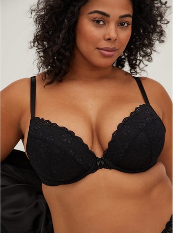 Front of model wearing black push-up bra