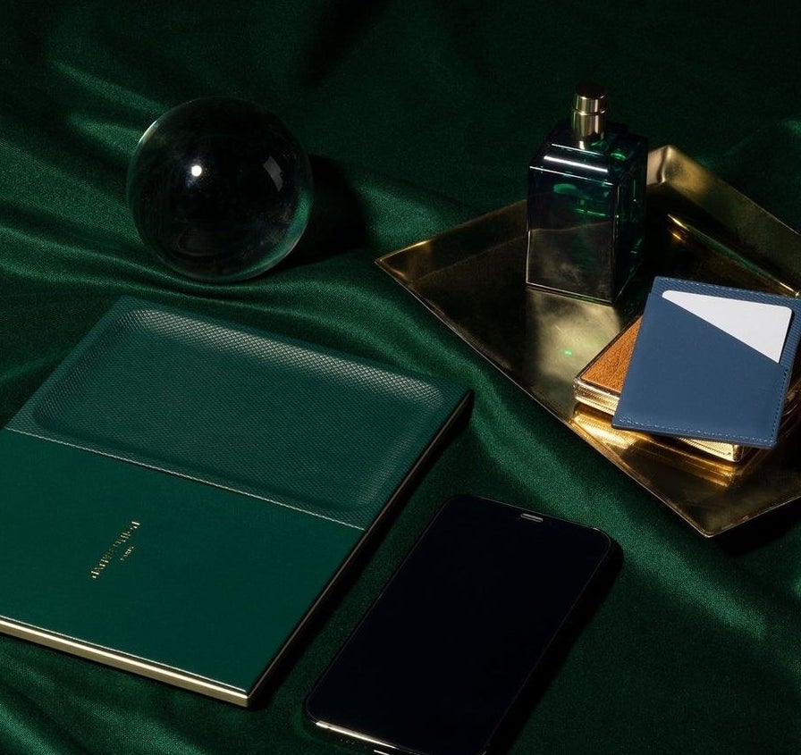 an elegant charging tray on a bed of matching velvet