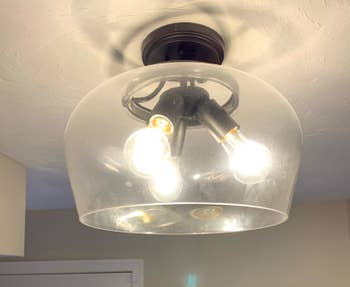 a dirty and cloudy glass light fixture