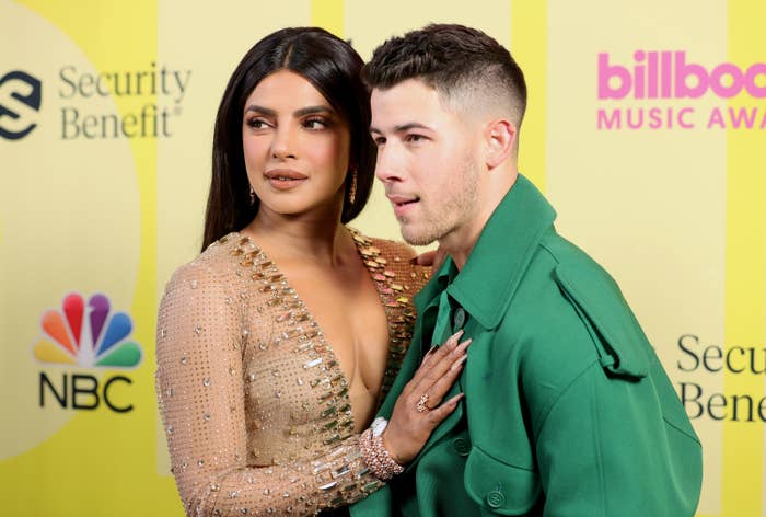The couple posing on the red carpet of the billboard awards