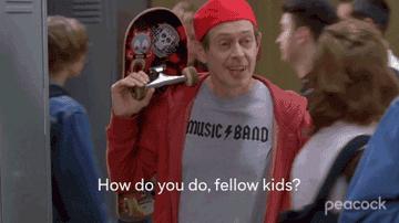Steve Buscemi as Lenny Wosniak holds a skateboard over his shoulder while wearing a hoodie and backwards cap as he approaches a high school hallway and says &quot;How do you do, fellow kids?&quot; in &quot;30 Rock&quot;
