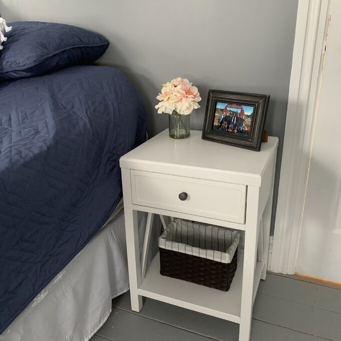 a reviewer photo of the white nightstand