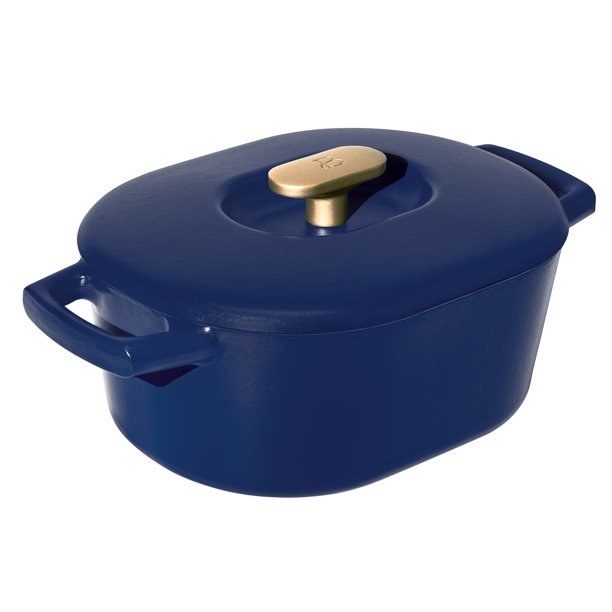 The 6QT Enamel Dutch Oven by Drew Barrymore in blue with a golden handle.