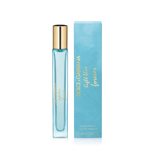 the blue travel size bottle next to the velvet packaging