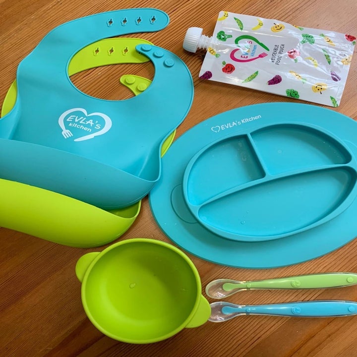 a reviewer photo of the entire feeding set sitting on a table