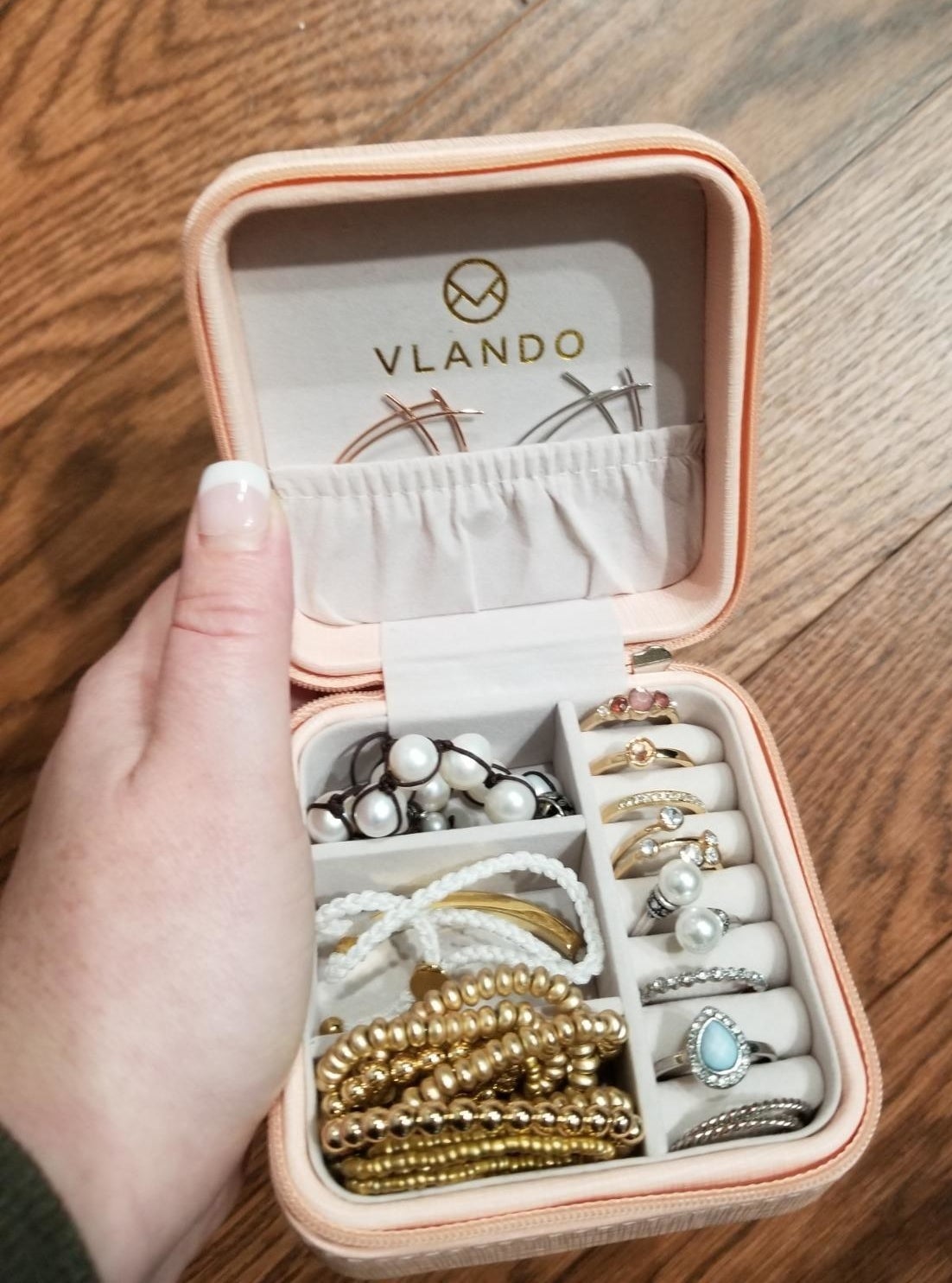 reviewer holding up travel jewelry case