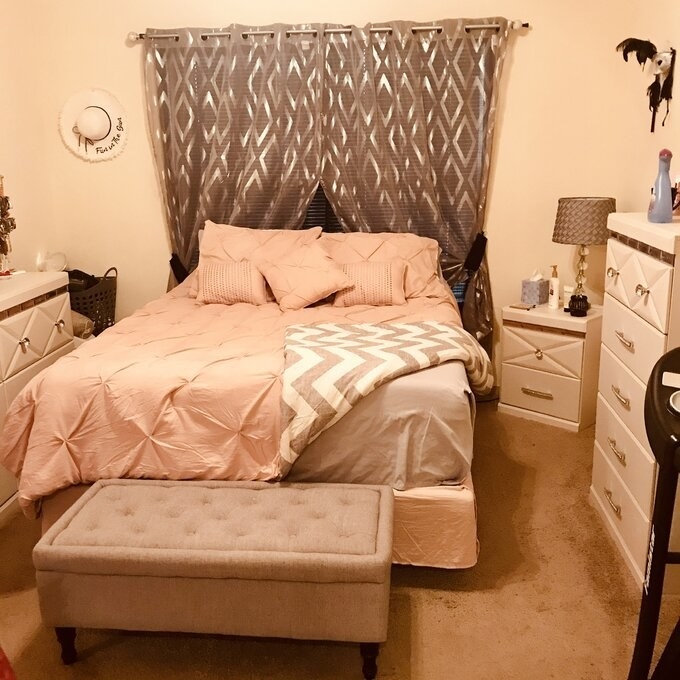 the comforter set in pink in a reviewer&#x27;s bedroom