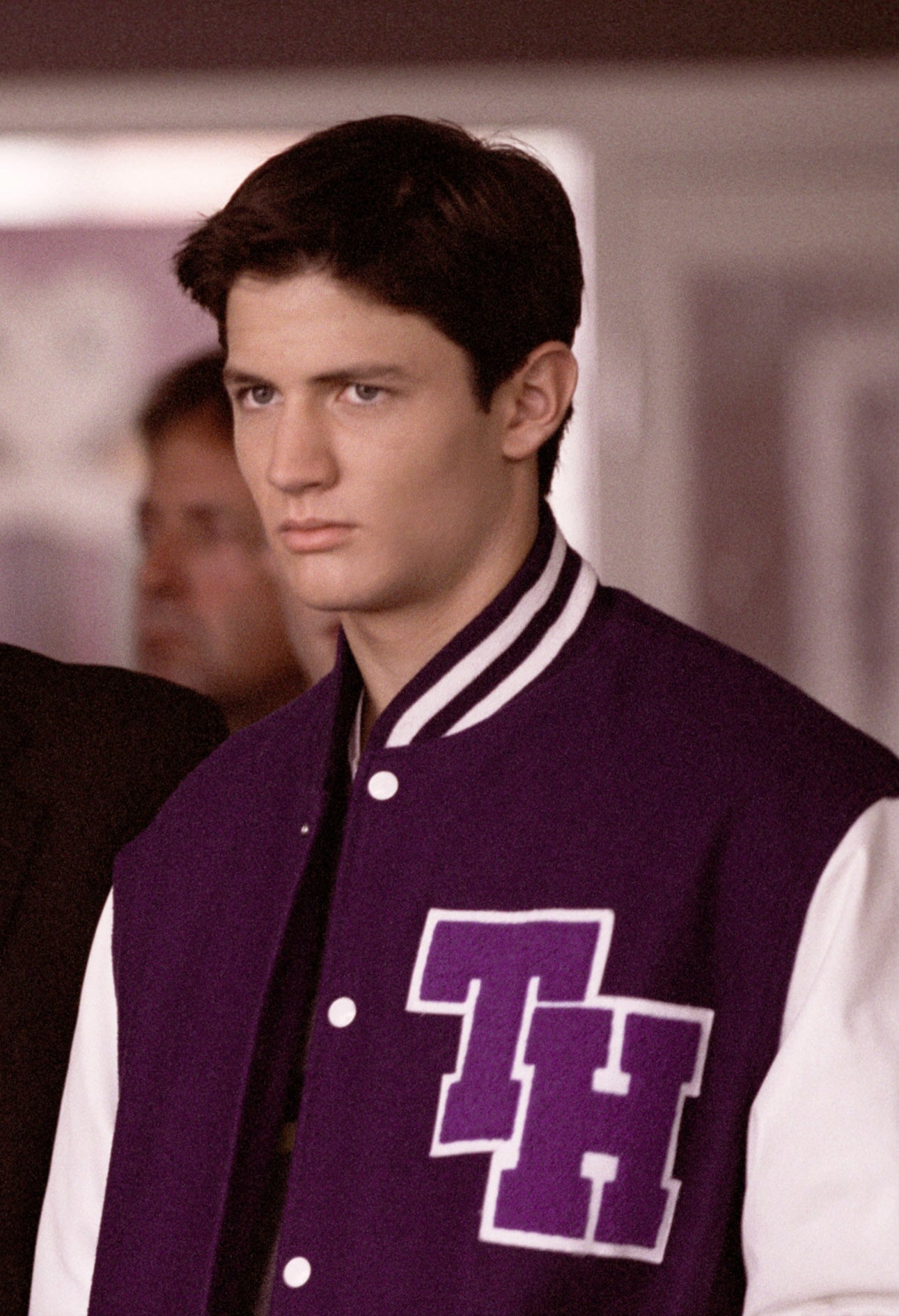 James as Nathan in a letter jacket