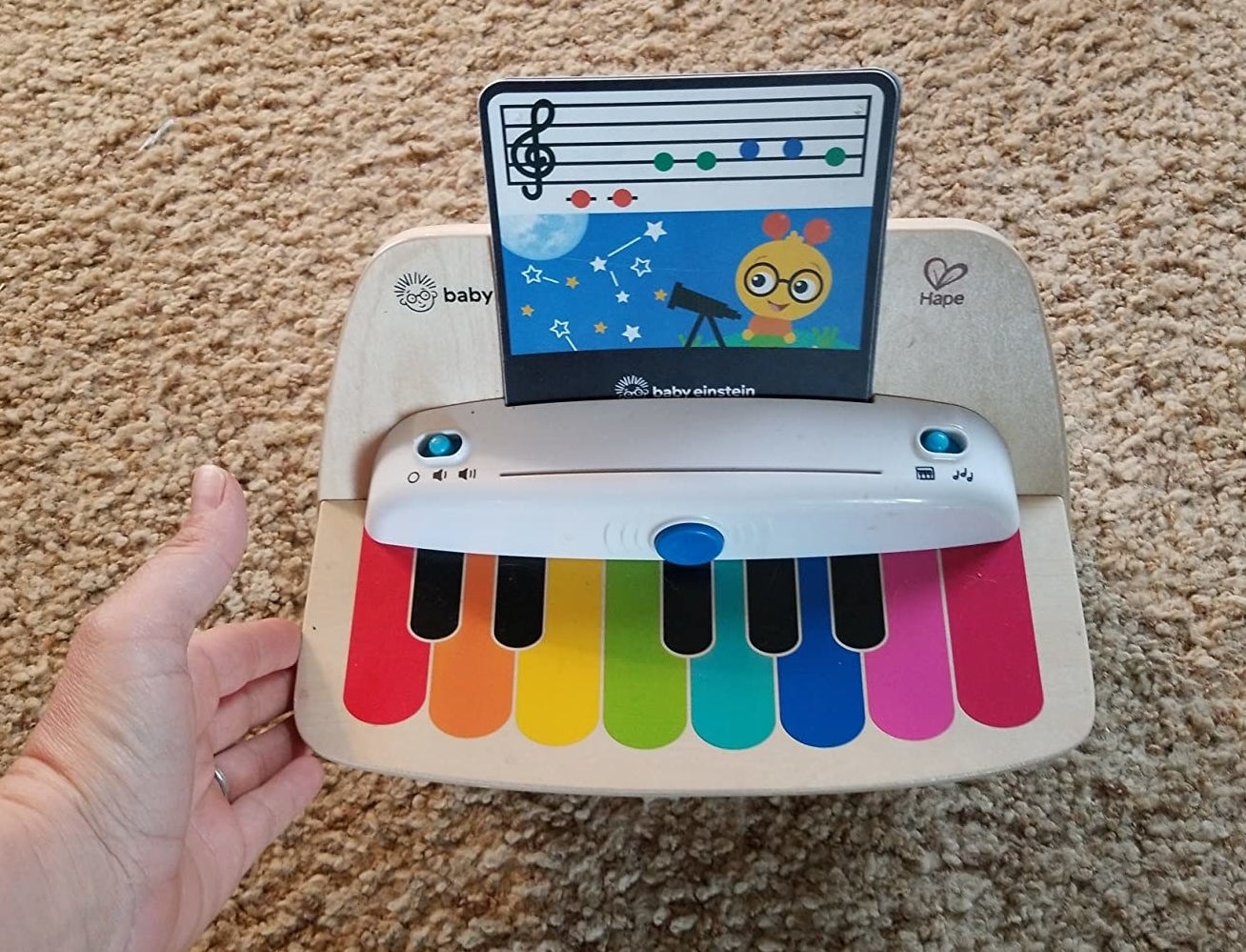 a reviewer photo of the piano with a music note card inserted