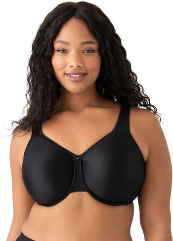 Front of model in black bra