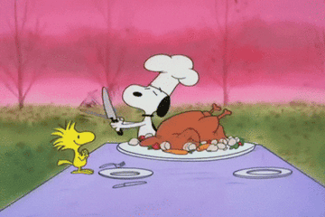 GIF of Snoopy getting ready to carve a Thanksgiving turkey