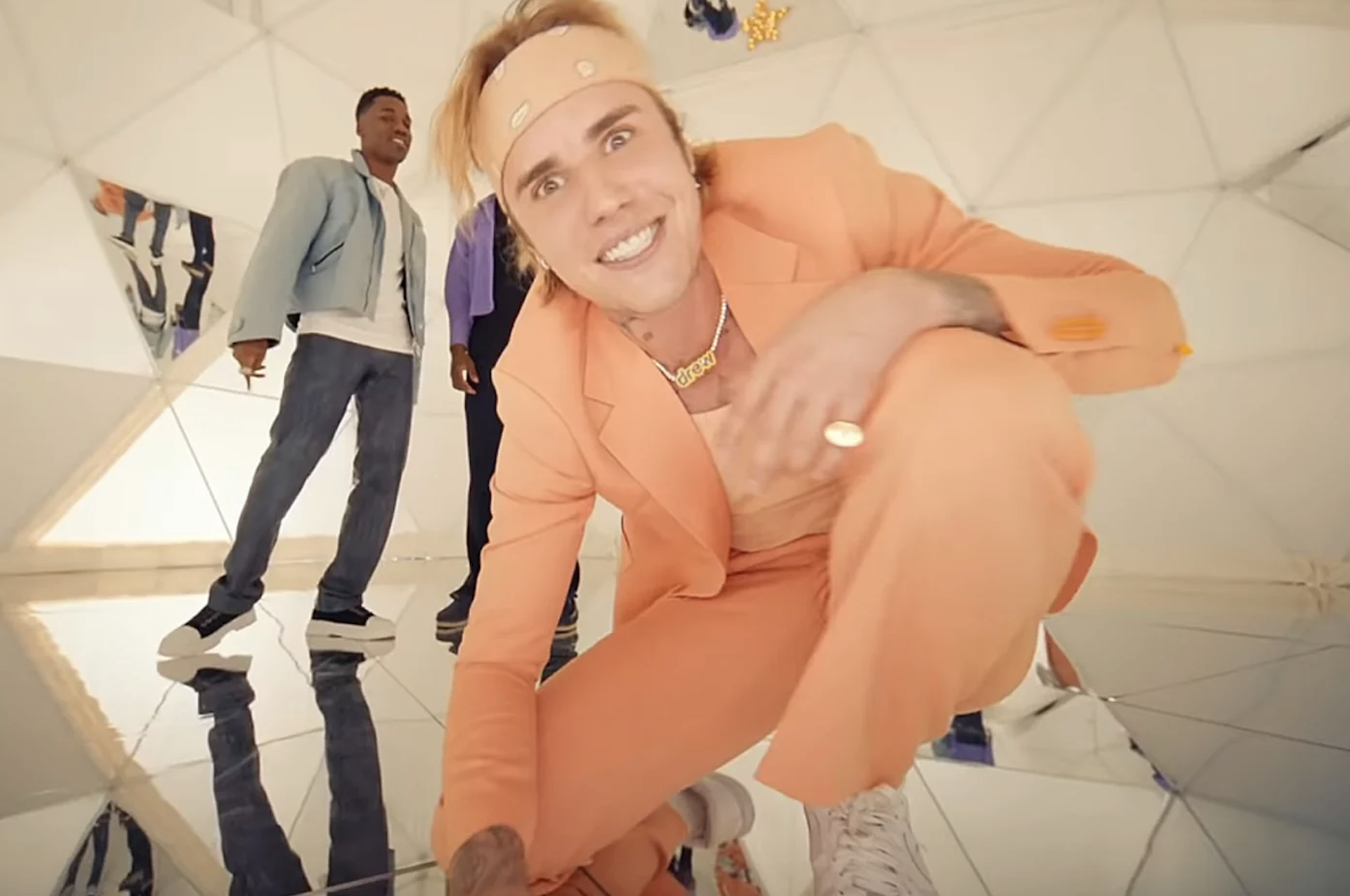 Justin Bieber with his eyes very wide open in the Peaches music video