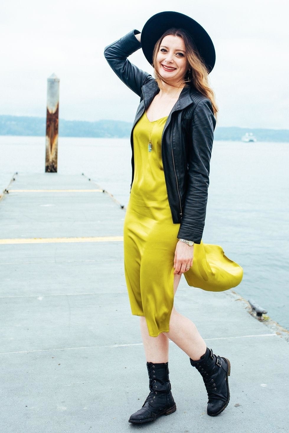reviewer wearing the v-neck slip dress in yellow