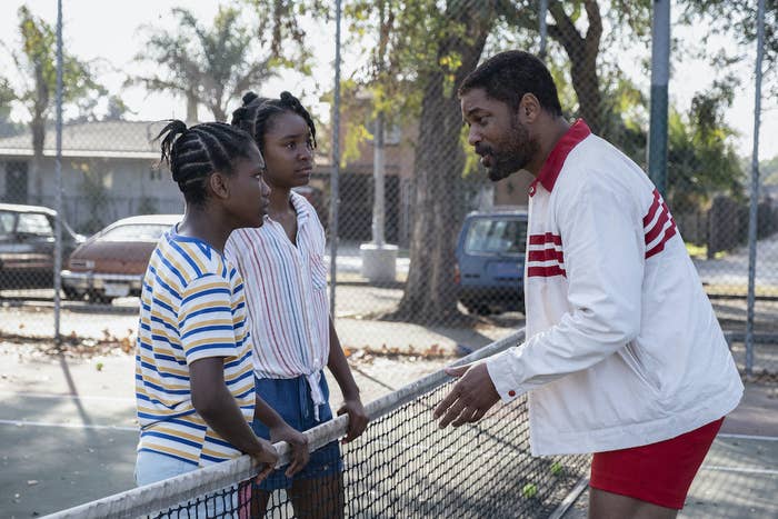 A scene from King Richard between Richard and young Venus and Serena Williams