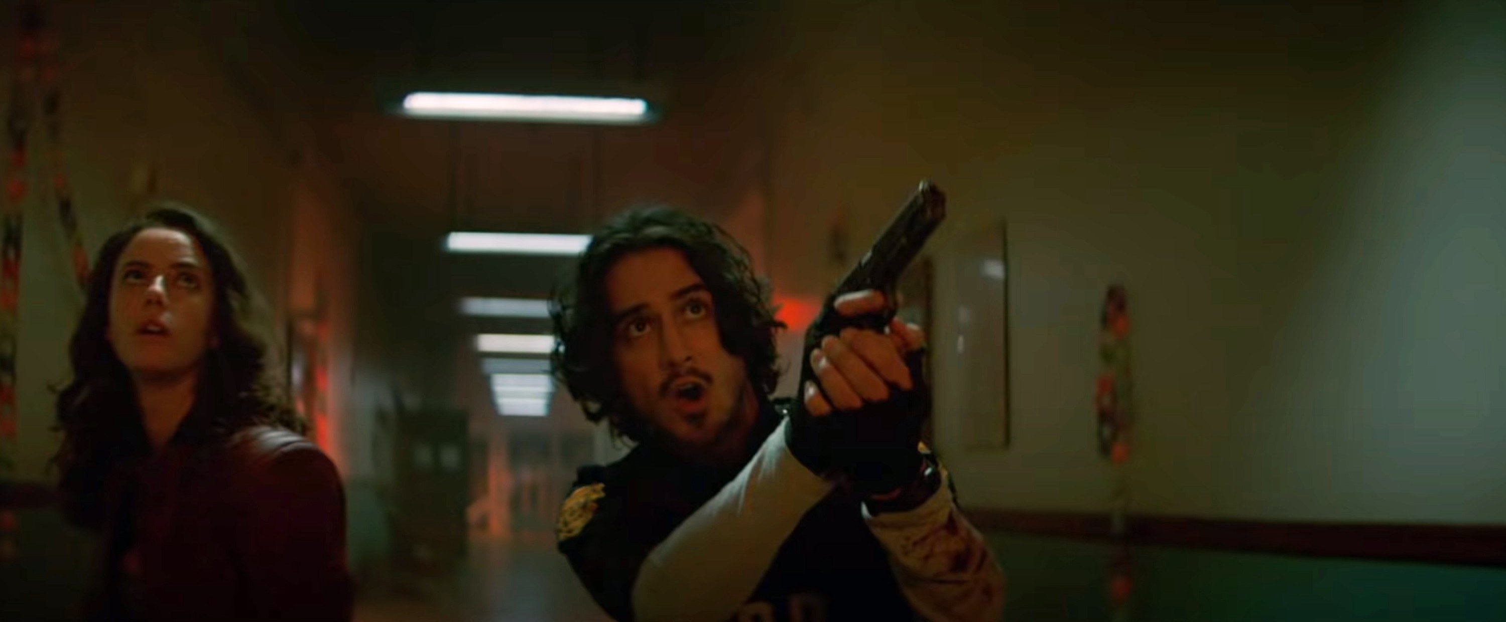 Avan pointing a gun in a scene from Resident Evil