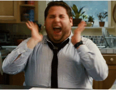 a gif of jonah hill pretending to scream with joy
