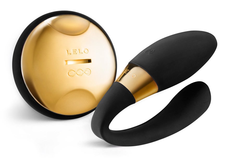 Black and 24K gold wearable vibrator and wireless remote control