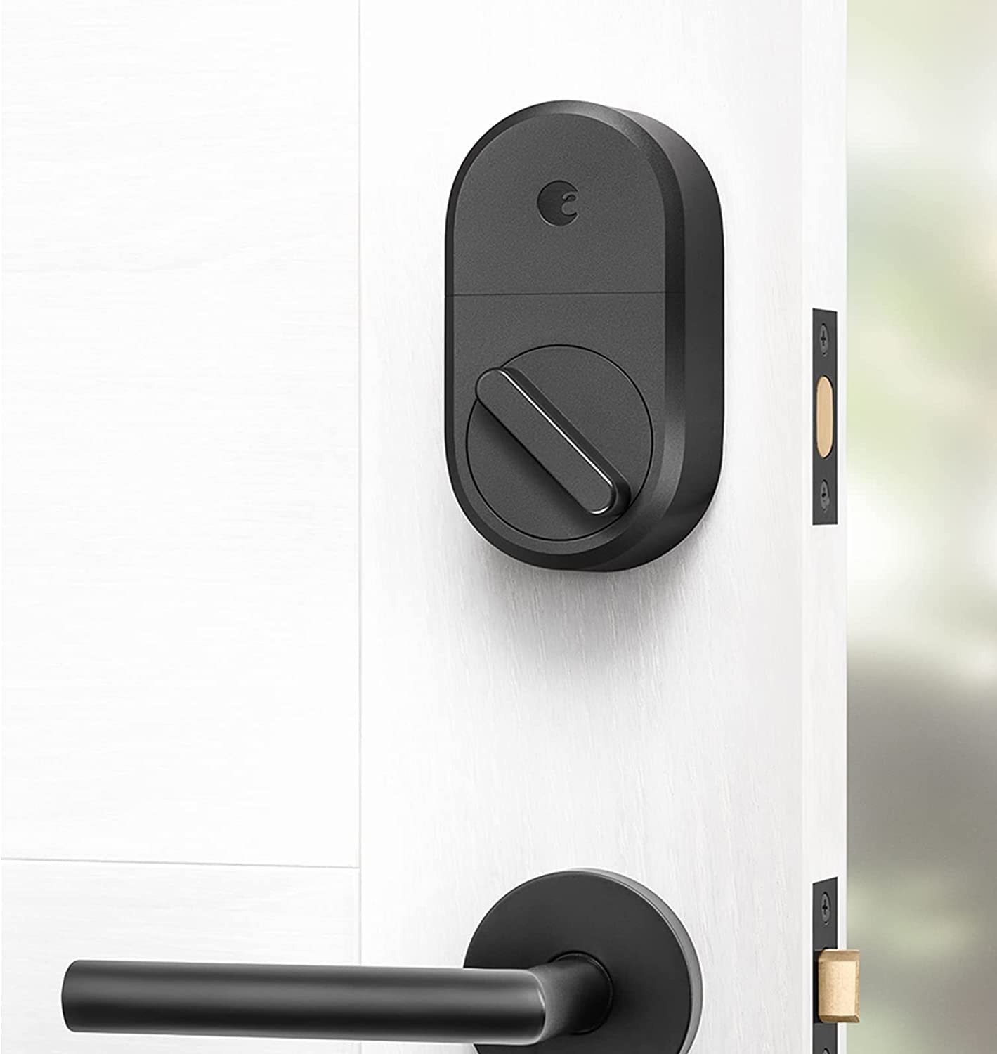 a close up of the smart lock installed on a front door