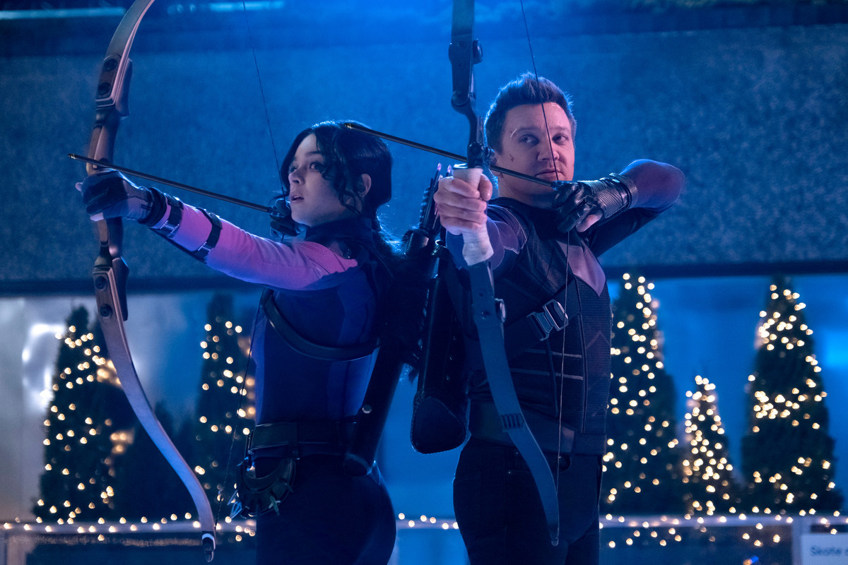 Kate and Clint with their bow and arrows at the ready