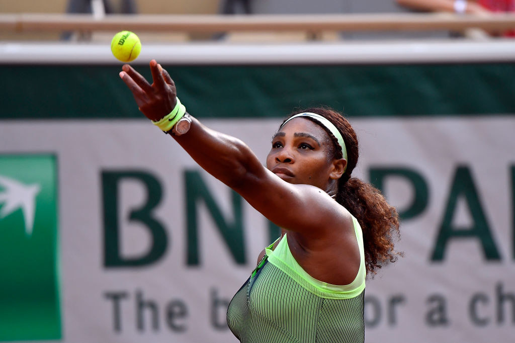Serena Williams serves during a tennis match