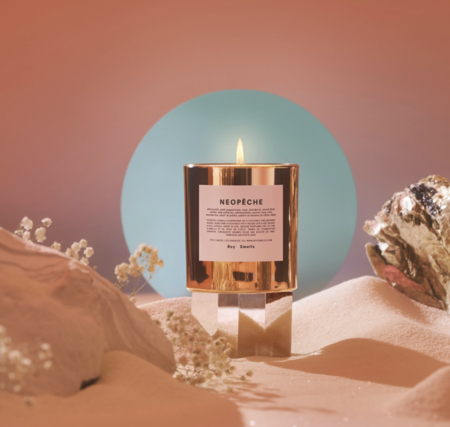 a metallic candle votive with a label that says neopeche