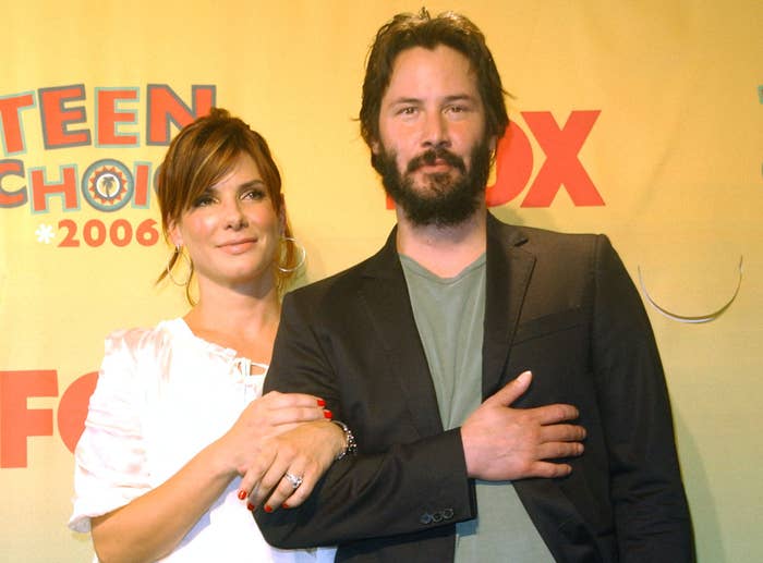 Sandra links arms with Keanu