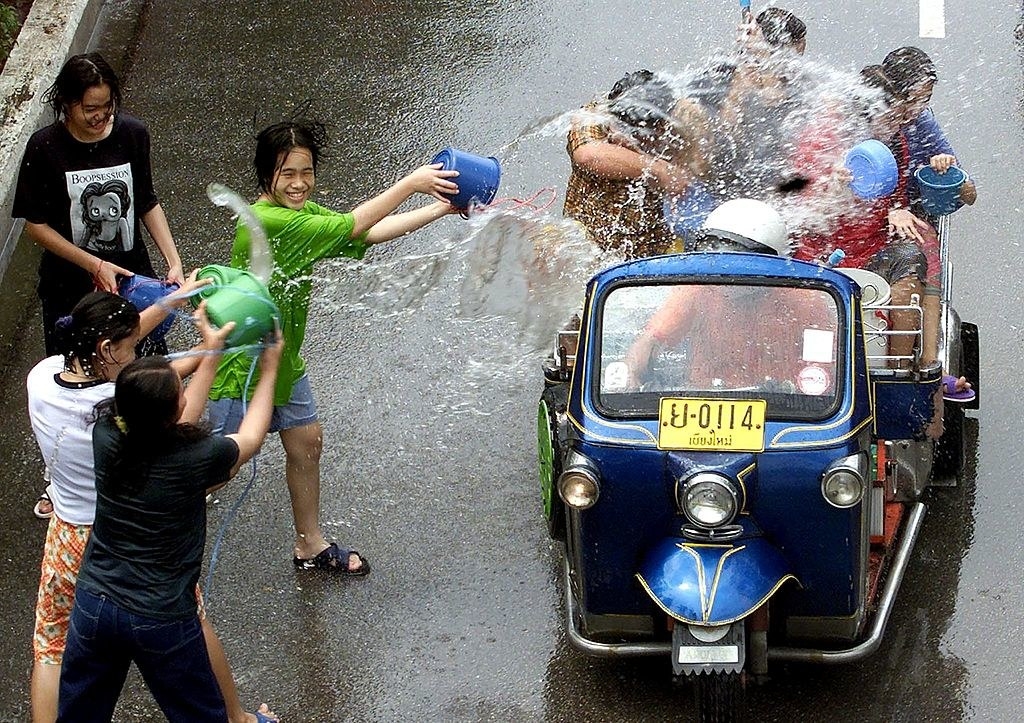 People splashing water at each other during the Songkran festival in Thailand