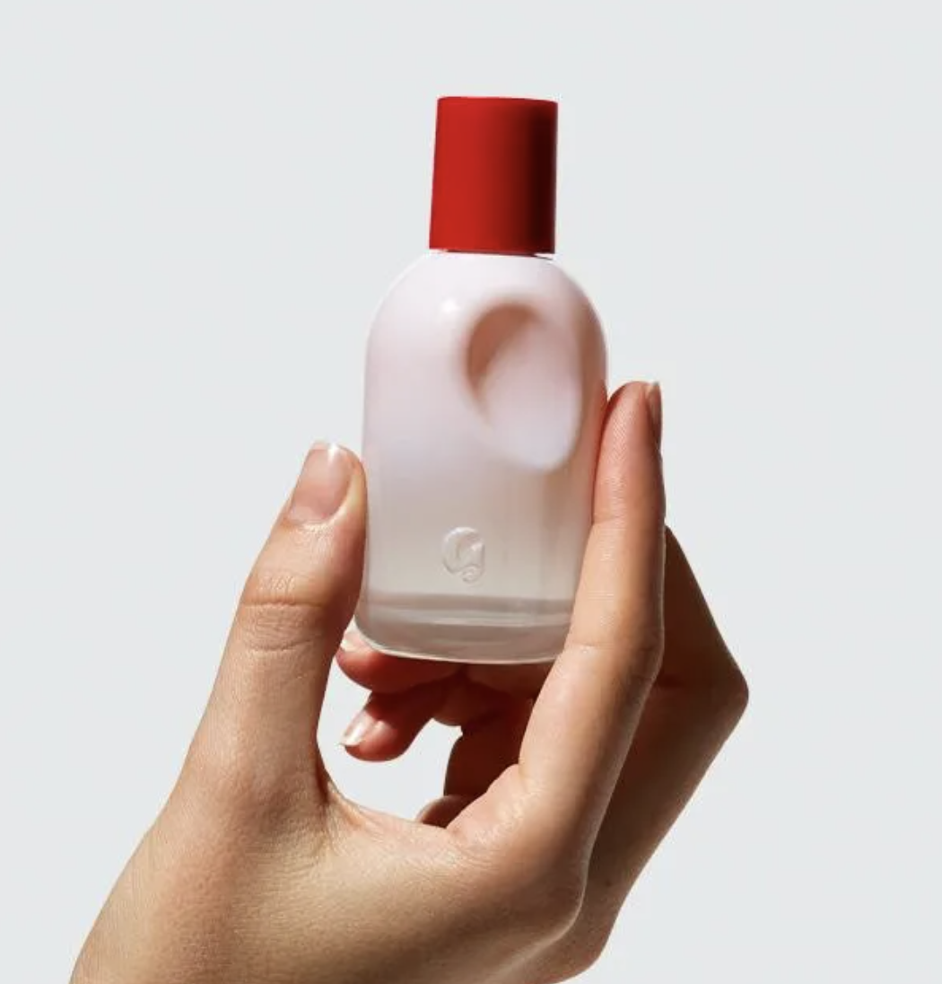 model holding the perfume bottle