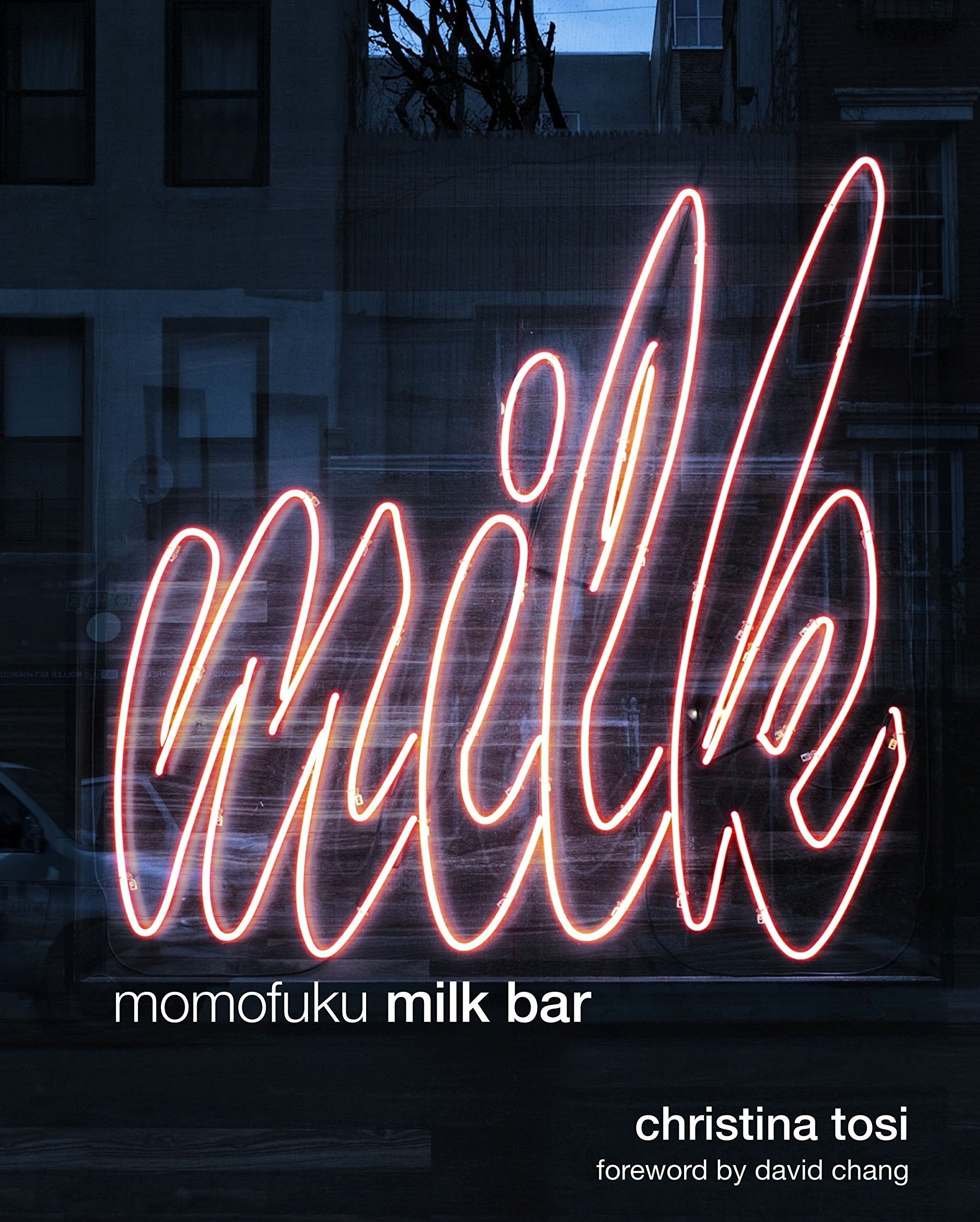 The cover of the cookbook with a neon sign that says &quot;milk&quot;