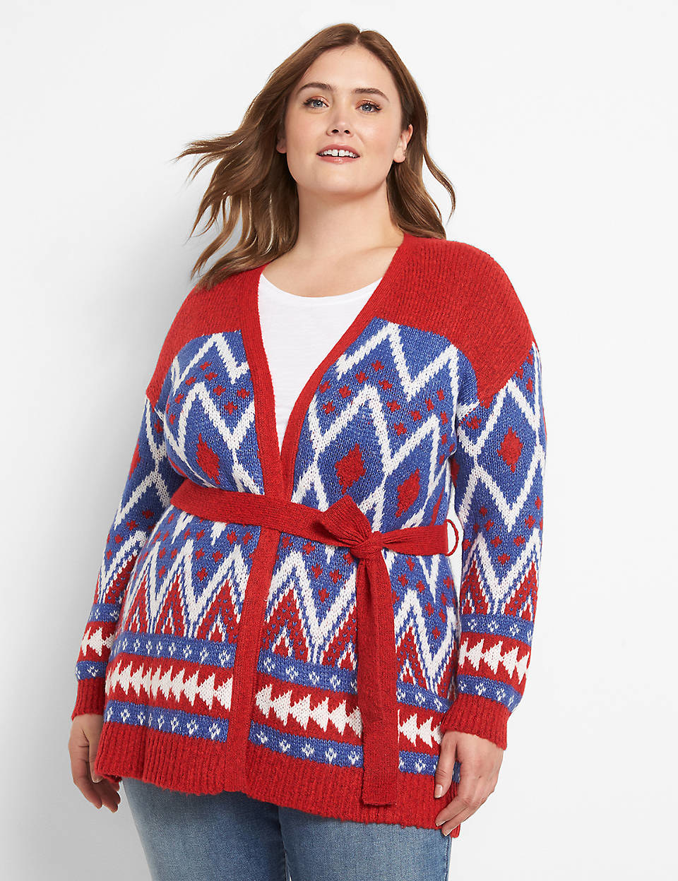 model wearing the belted cardigan with a red, white, and blue pattern