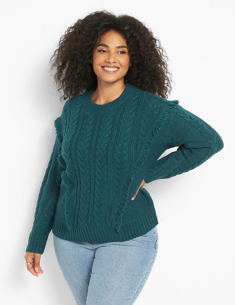model wearing the cable knit sweater in teal