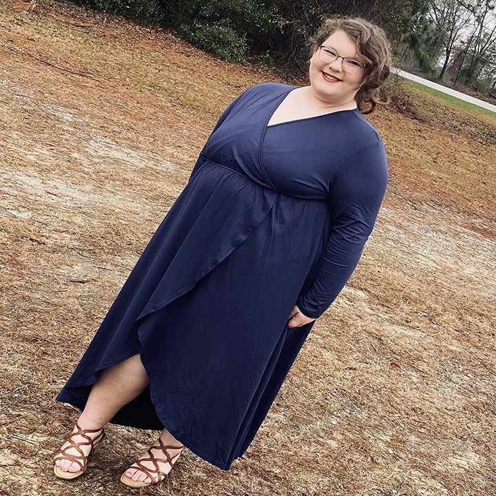 Reviewer wearing the dark blue dress