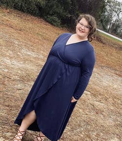 Reviewer wearing the dark blue dress with brown sandals