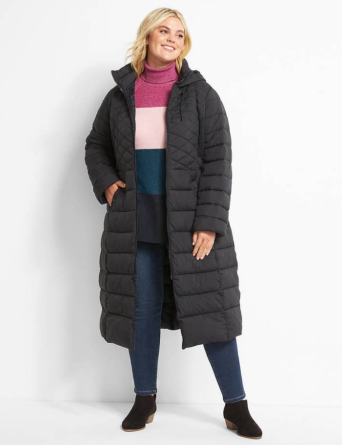 model wearing the puffer coat with hood in black