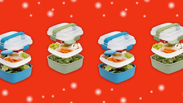 Four salad containers on a red background.