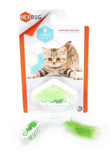 Green nano bot toy with green feather attached