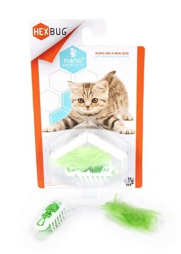 Green nano bot toy with green feather attached