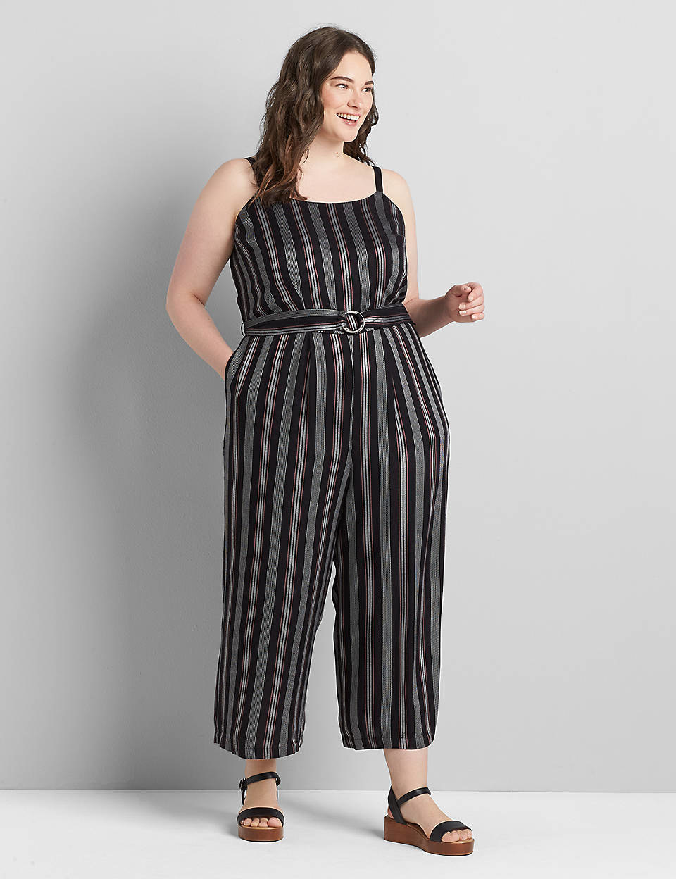 model wearing the black and silver vertical strip belted cami jumpsuit