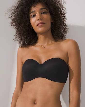 Model wearing black wireless and strapless bra