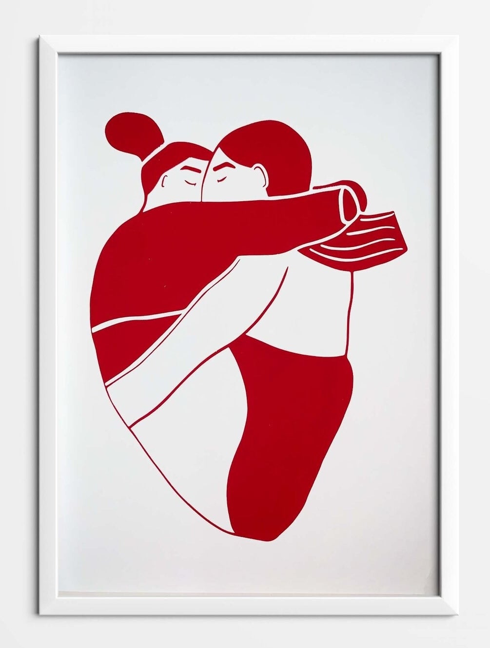 a print of two people hugging and kissing