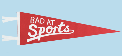 a red pennant with white lettering that says &quot;bad at sports&quot;