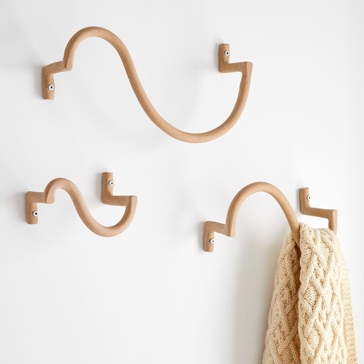 three of the wavy hooks mounted on a wall